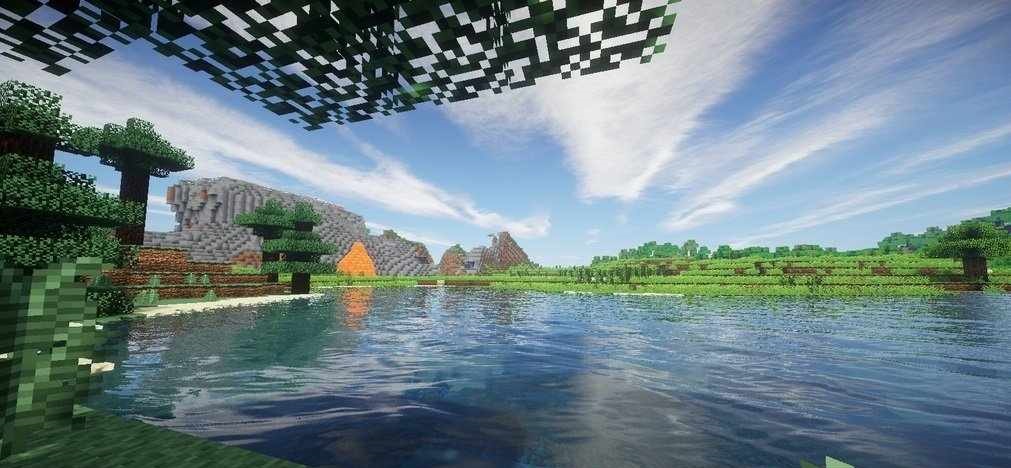 Горный биом в Minecraft с улучшенными шейдерами, показывающий детализацию ландшафта