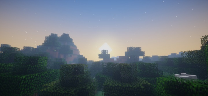 Игрок стоит на вершине горы с видом на огромный мир Minecraft