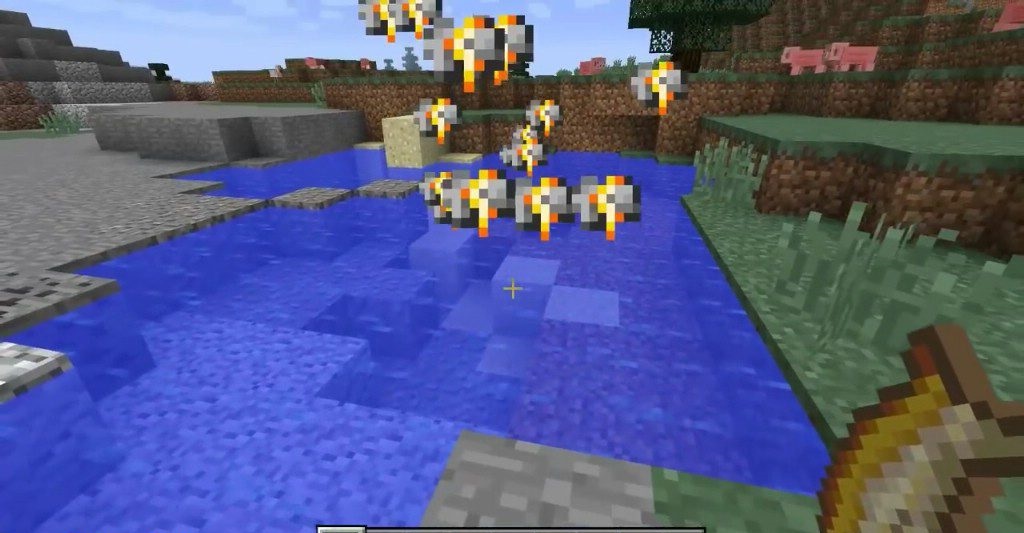 Игрок ловит золотую рыбку удочкой в Minecraft с модом Goldfish Myth