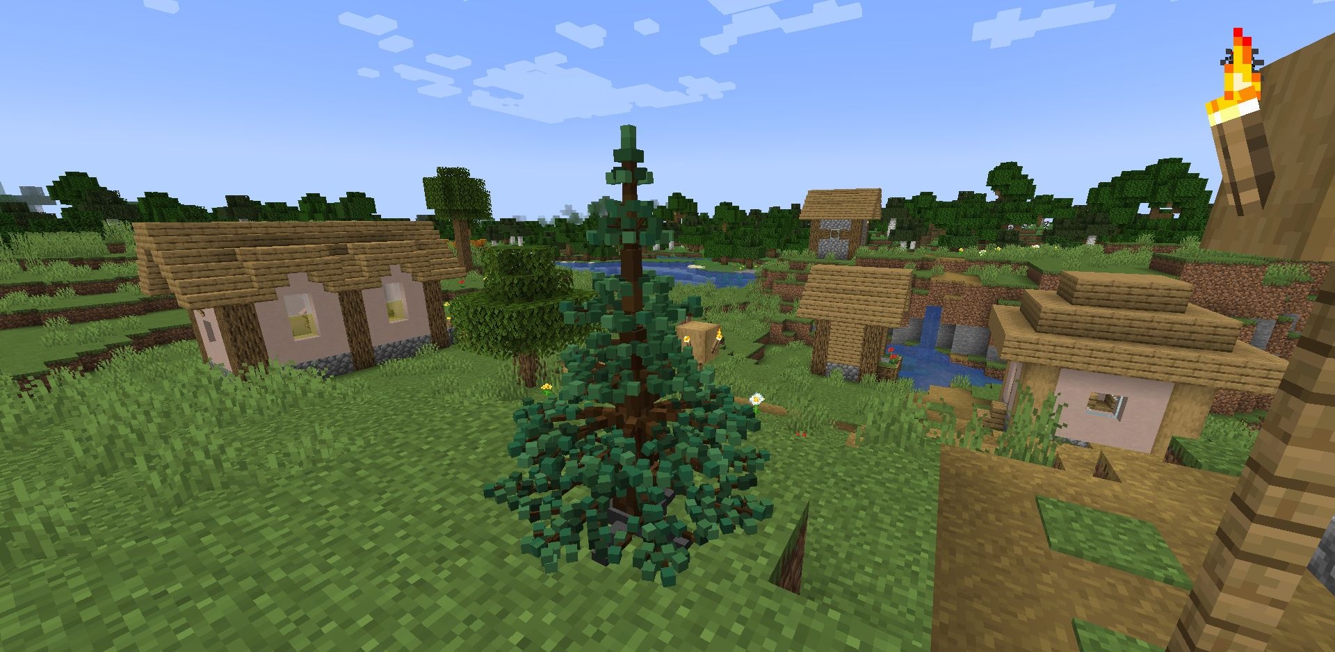 Игрок в рождественском костюме рядом с украшенной ёлкой в Minecraft